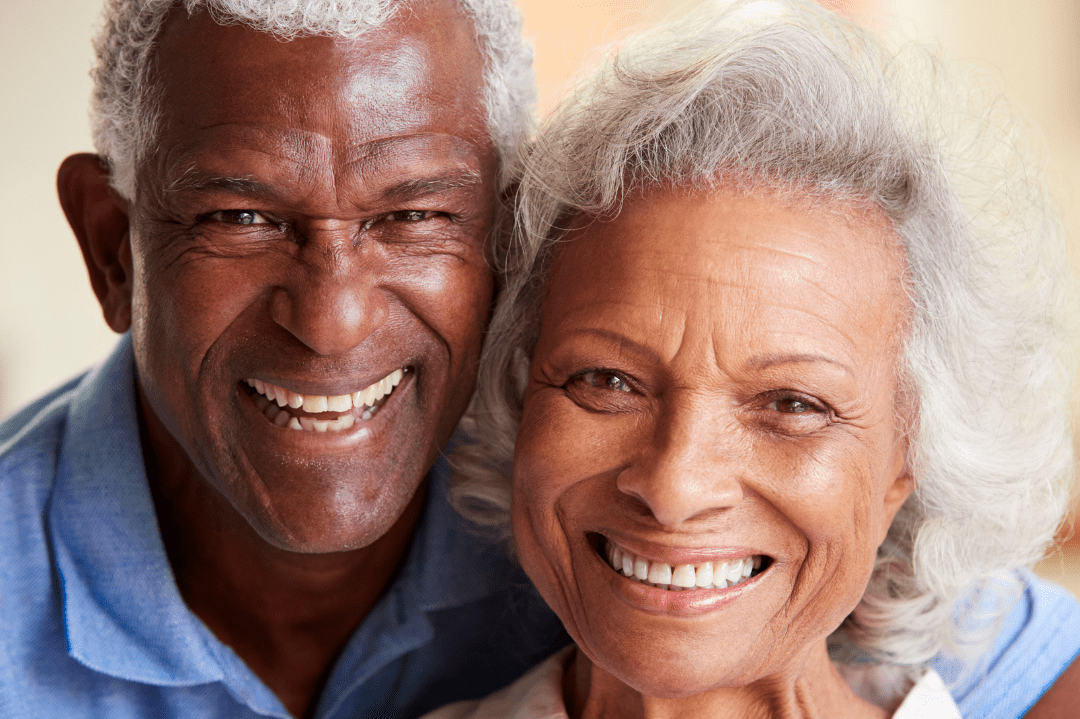 Happy smiling seniors facing camera